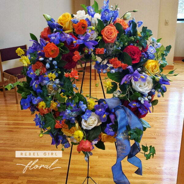 Colorful and Bright flower funeral wreath.
