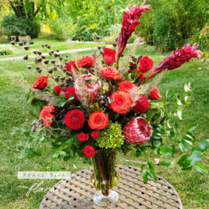 Fortune Bright red Florals with mixed local greensFlower Arrangement