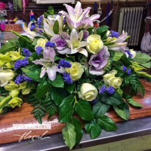 Funeral Casket Spray Daybreak of White & Purple flowers