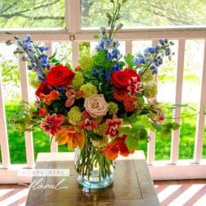 Vibrant and Colorful Into the Wild signature flower arrangement by Rebel Girl Floral, featuring roses, tulips, spray roses, dahlias, and delphiniums.